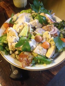 Chicken Salad with fresh cherry tomatoes, avocado, red onion, parsley and basil.,  